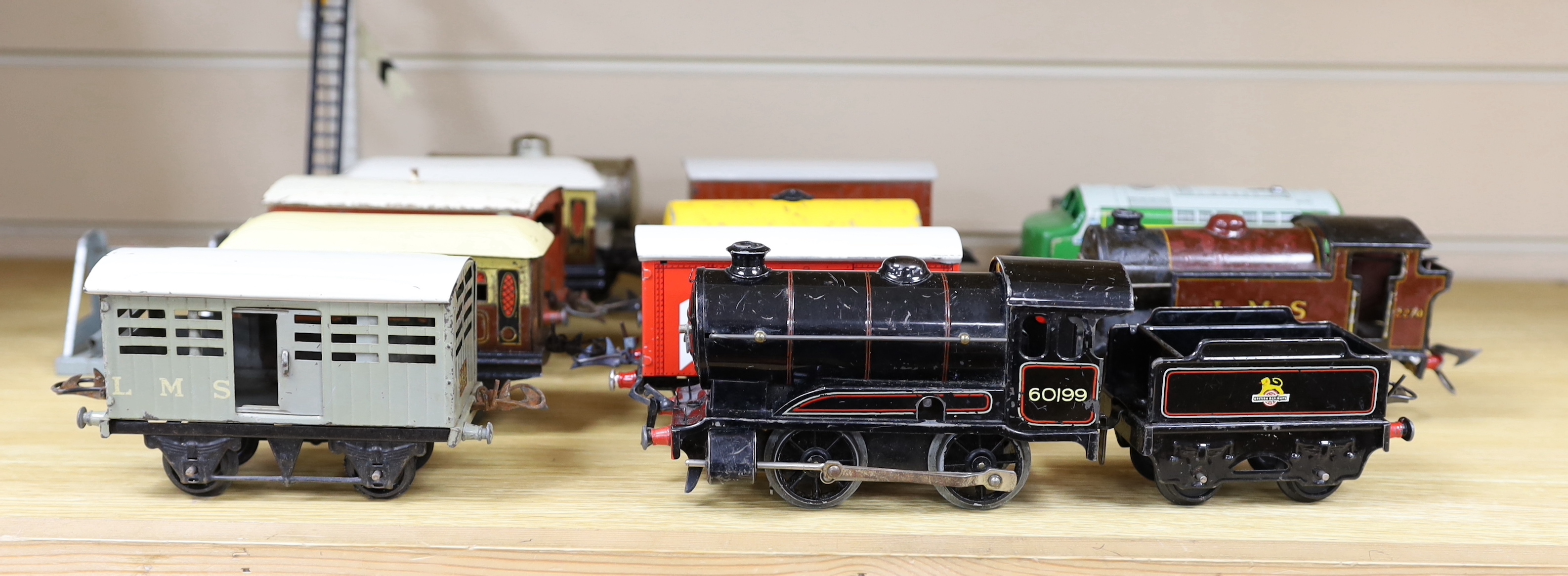 Thirteen Hornby 0 gauge tinplate items including; a clockwork 0-4-0 tender loco, 60199, a 20v electric 0-4-0T loco, 2270, an electric 0-4-0 diesel loco by another maker, marked Made in Great Britain, together with seven